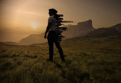 Full length of person on field against sky during sunset