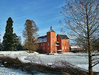 Houses on snow covered landscape
