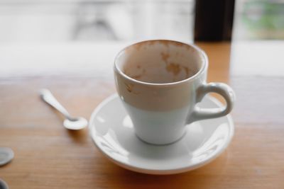 Close-up of coffee cup on table