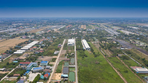 High angle view of city buildings against sky