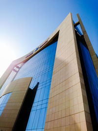 Low angle view of modern building against clear blue sky