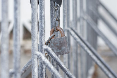 Close-up of padlock on railing