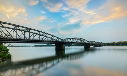 Bridge over river against sky