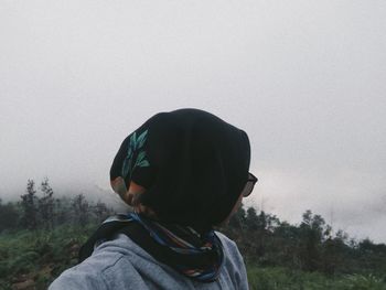 Portrait of boy wearing sunglasses against sky