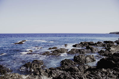 Scenic view of sea against clear sky