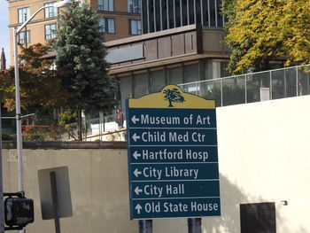 Close-up of information sign in city