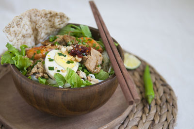 Vietnamese noodle - my quang, vietnamese traditional cuisine, noodles in bowl on the table 