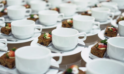 Coffee and cups on table