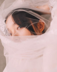 Close-up of young woman wearing veil