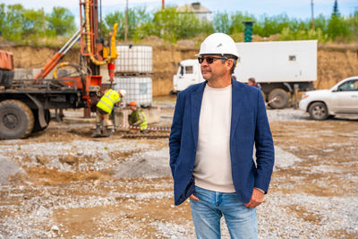 Rear view of man standing on road