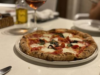 Close-up of pizza served on table