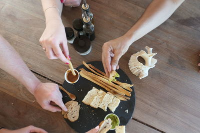 High angle view of woman preparing food on table