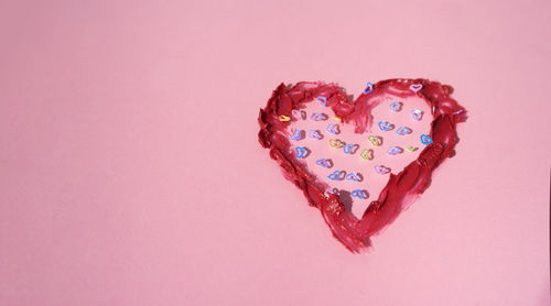 Directly above shot of heart shapes on white background