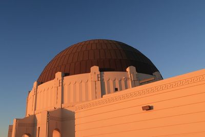 Low angle view of building against clear blue sky