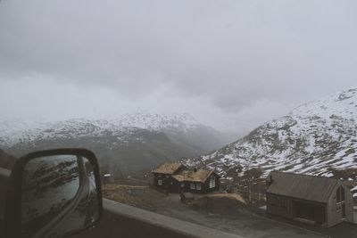 Cars in parking lot against sky