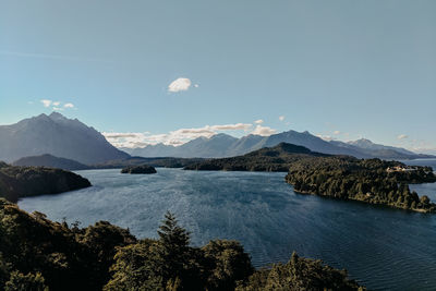 Scenic view of mountains against blue sky