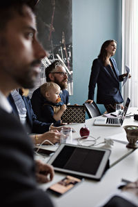 Business people concentrating during meeting in board room