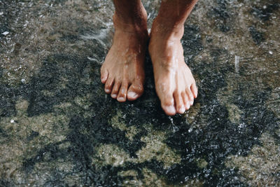 Low section of man on rock