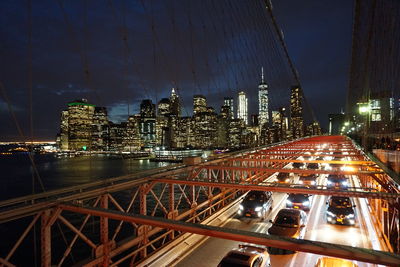 Illuminated city against sky at night