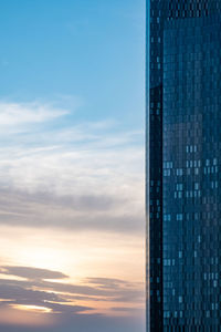 Low angle view of building against sky during sunset