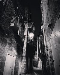 Low angle view of illuminated buildings at night