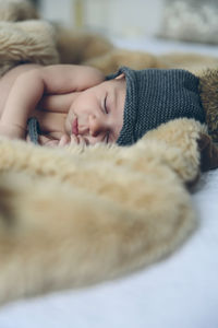 Cute boy sleeping on bed