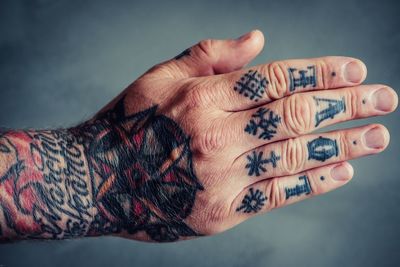 Close-up of woman hand with tattoo