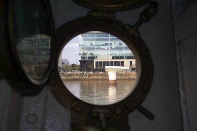 Building reflecting in water