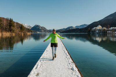 Beautiful winter landscape with long jetty in austria