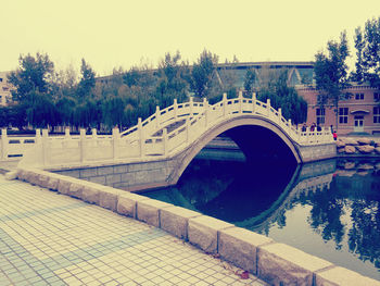 View of bridge over water against clear sky