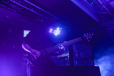 Low angle view of man playing guitar