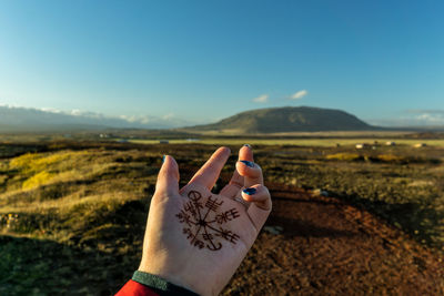 Close-up of hand with tattoo