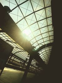 Low angle view of sunlight streaming through skylight