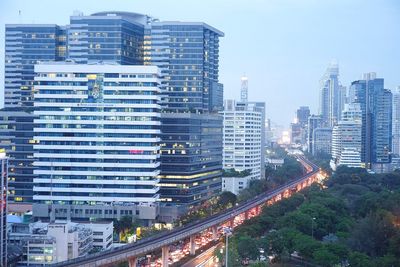 High angle view of illuminated cityscape against sky