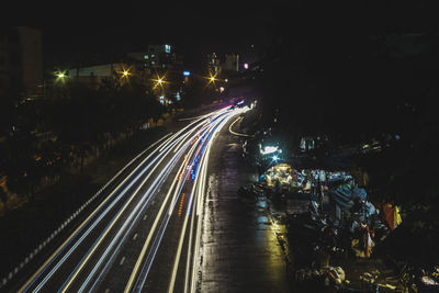 High angle view of light trails on road at night