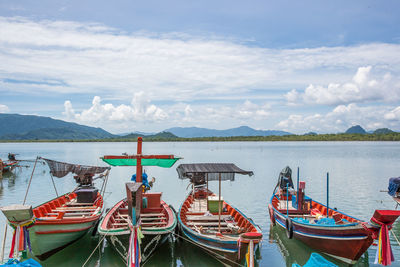 Boats moored at harbor