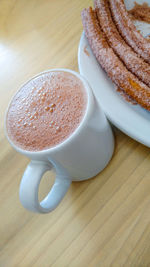 High angle view of coffee cup on table