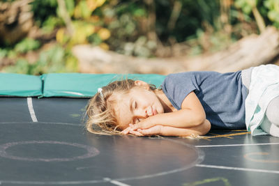 Cute girl lying down outdoors