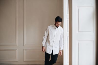 Groom standing by door