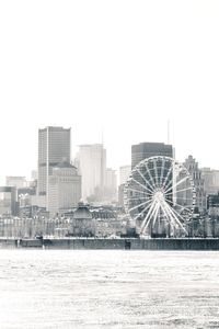 View of buildings in city against clear sky