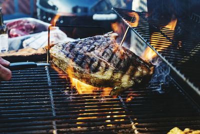 Close-up of meat cooking on barbeque grill