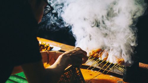 Close-up of man playing guitar