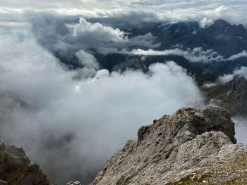 Scenic view of clouds over mountains