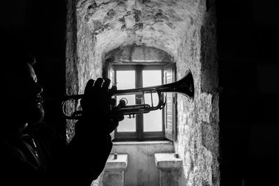 Close-up of man playing trumpet