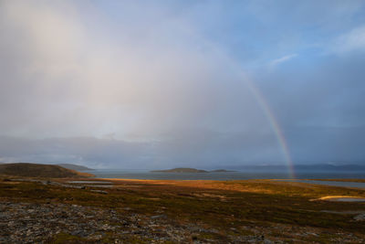 Nordic landscape with rainbow