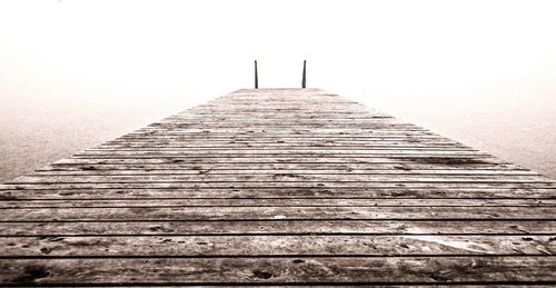 Boardwalk against clear sky