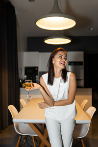 Young woman sitting at home 