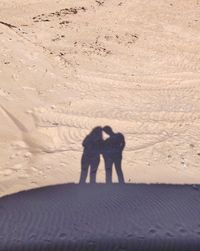 Shadow of man on sand