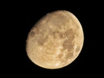 Low angle view of moon against clear sky at night