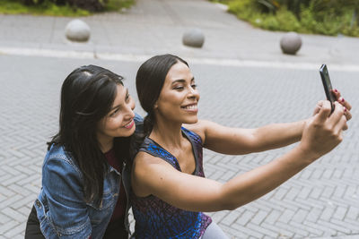 Two college girl taking a selfie